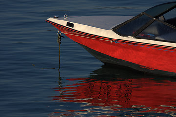 Image showing tip of red and white speedboat