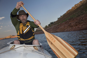 Image showing mature male in a canoe