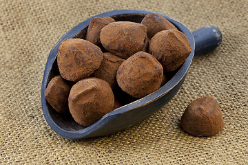 Image showing scoop of chocolate truffles