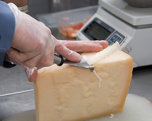 Image showing cutting cheese