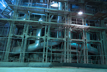 Image showing Equipment, cables and piping as found inside of a modern industr