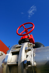 Image showing Industrial zone, Steel pipelines and valves against blue sky