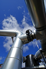 Image showing Industrial zone, Steel pipelines and valves against blue sky