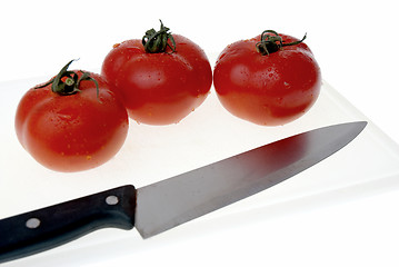 Image showing Cutting board with a knife and tomato