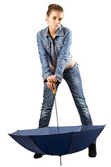 Image showing Playful woman in a blue denim suit