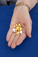 Image showing Taking pills