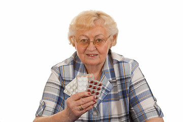 Image showing Holding pills