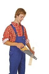 Image showing Carpenter with handsaw