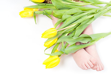 Image showing Little girl foots with flowers