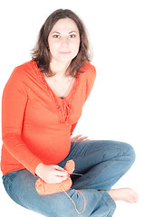 Image showing Portrait of pretty pregnant woman knitting