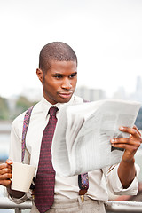 Image showing Businessman reading newspaper