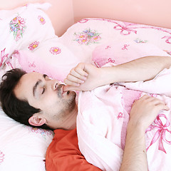 Image showing Young man sleeping .