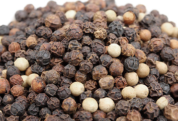 Image showing Heap of black and white pepper