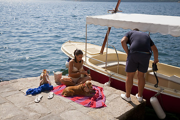 Image showing Couple and dog by the sea