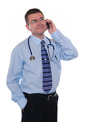 Image showing Smiling doctor makes phone call