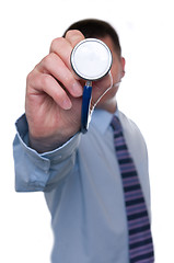 Image showing Doctor points stethoscope at camera