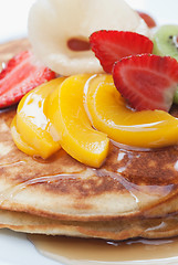 Image showing Pancakes with fruit on top