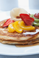 Image showing Pancakes with fruit on top