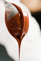 Image showing spoon with liquid chocolate