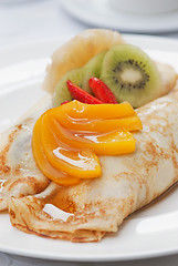 Image showing Pancakes with fruit on top