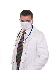 Image showing Doctor with face mask looks intently at camera