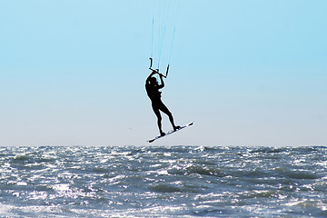 Image showing Silhouette of kite surfer in a sea 