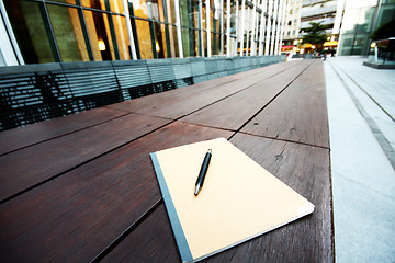 Image showing book and pen on chair