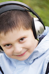 Image showing Portrait of smiling kid in headphones