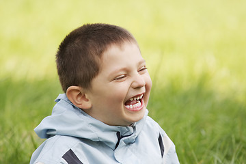 Image showing Laughing little kid in grass