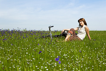 Image showing Girl with a bicycle