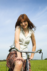 Image showing Girl with a bicycle