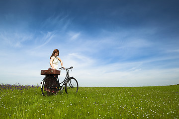 Image showing Girl with a bicycle