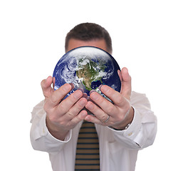 Image showing Businessman holds globe featuring America