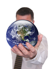 Image showing Businessman holds globe featuring America