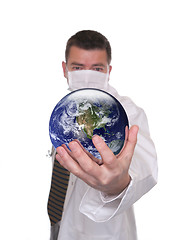 Image showing Doctor holds world globe featuring America