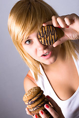 Image showing woman eating chocolate chip cookies