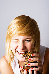 Image showing woman eating chocolate chip cookies