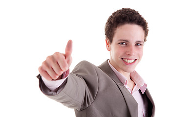 Image showing young man smiling, with thumb up