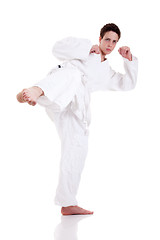 Image showing kick ok martial art, isolated on a white background: - sports exercise