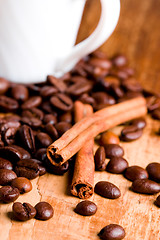 Image showing coffee beans, cup and cinnamon 