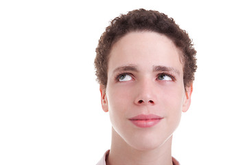 Image showing handsome young man smiling and looking up 