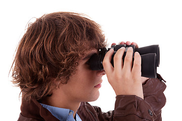 Image showing Young boy looking through binoculars