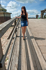 Image showing Beauty girl on the old-time bridge.