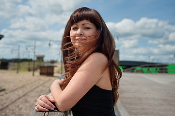 Image showing Beauty girl on the old-time bridge.