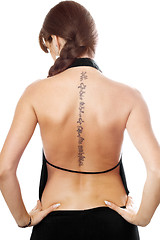 Image showing Young woman with a tattoo on her back