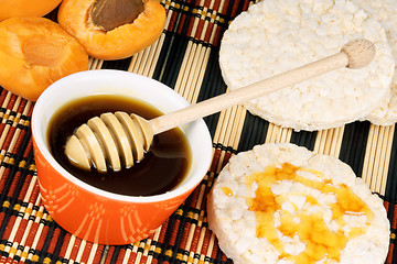 Image showing Honey, apricots and rice cakes