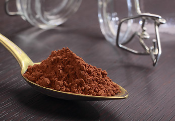 Image showing Spoonful of cocoa powder