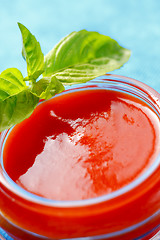 Image showing Tomato sauce with basil leaves