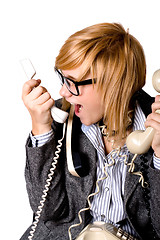Image showing businesswoman with three phones