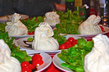 Image showing Italian Burrata cheese with tomatoes and rocket